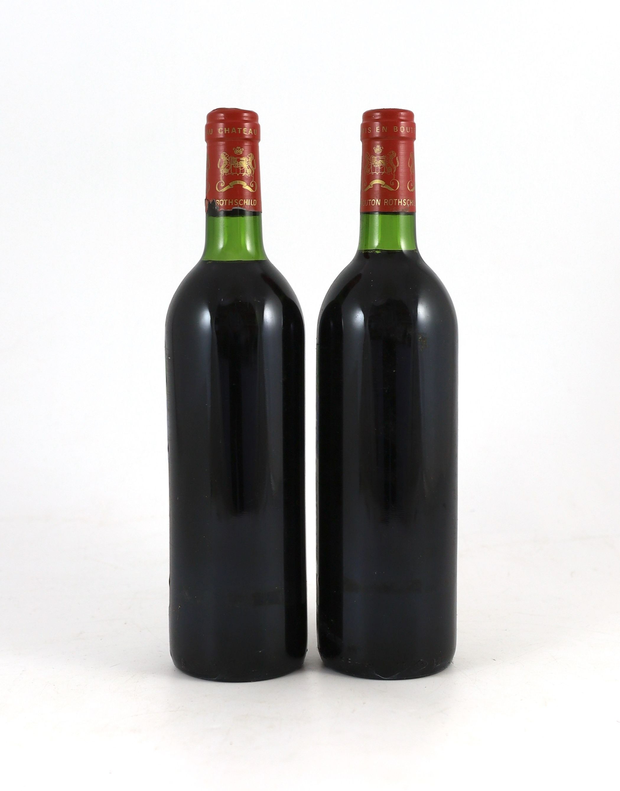 Two bottles of Chateau Mouton Rothschild 1982, height 30cm